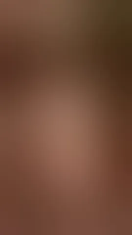 Riding a big dildo with naked oily boobs