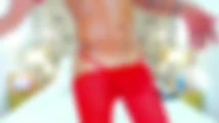 in thong and fishnet stockings