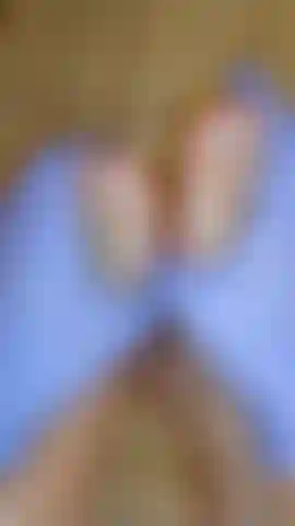 Rubbing feet with gloves and baby oil