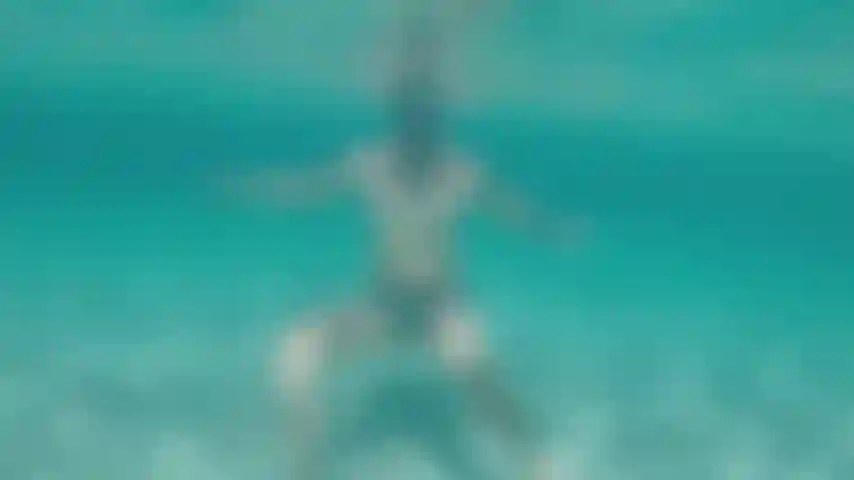 Taking my speedo off in the sea water whilst nobody was watching and enjoying a naked swim.