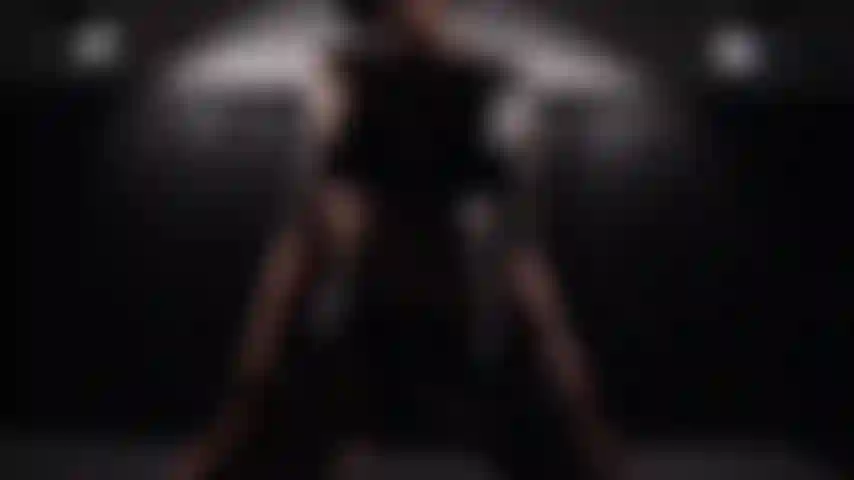 A sap-slow seduction in leather lingerie and chiaroscuro.