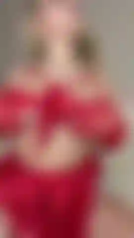 Miss Santa teases you with her tits