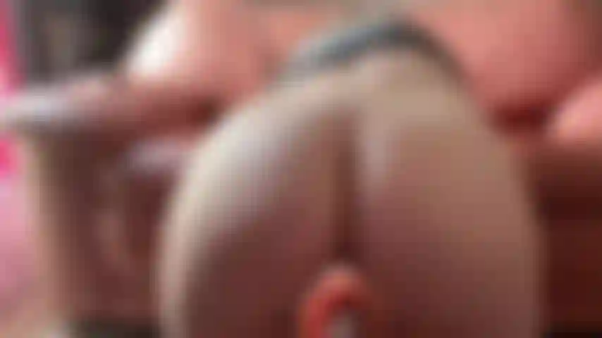 I'm on all fours in doggy pose, ass up high, back arched. The fuck machine slams its thick dildo deep into my tight pussy from behind, pounding hard and fast. I moan loudly with every powerful thrust, juices dripping down my thighs as it stretches and fills me relentlessly.