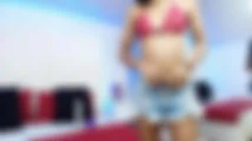 Your lady in red enjoys taking off her clothes and giving herself a good massage on her wet and horny pussy