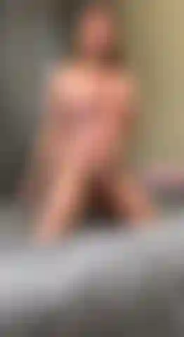 The girl is completely naked and kneeling in front of you.