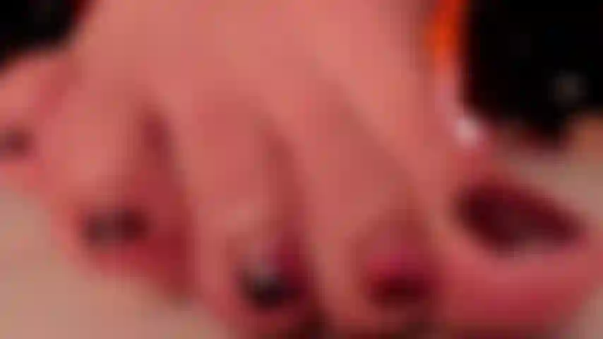 closeup of feet on big big toes, shiny nails and shiny feet