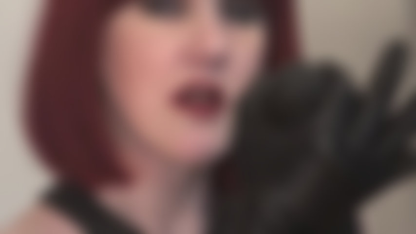 Mistress Vivian winks at you stroking BBC with leather gloves, knowing how much you love black cock.