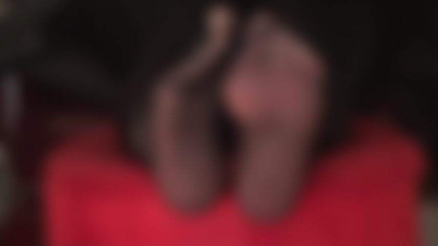 Sheer black pantyhose foot tease - Mistress has her beautiful nylon feet propped up on a stool, wiggling them right in front of your face.