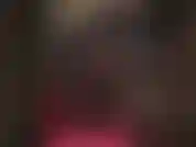 Um maravilhoso macacão justo de lycra semi transparente com espartilho e botas de cano alto.