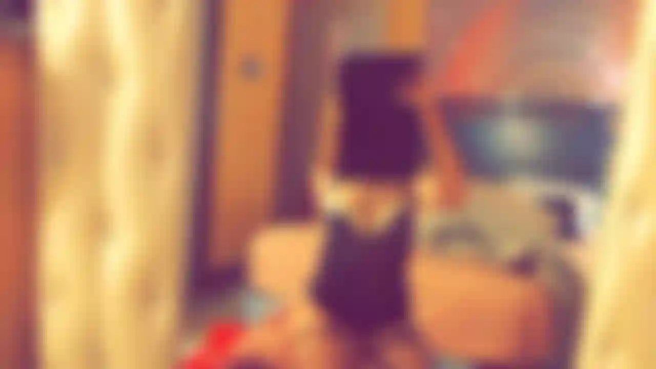 rubbing my body while showing my fishnets and lingerie top and grabbing my ass