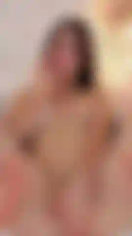 naked with her hand on her pussy