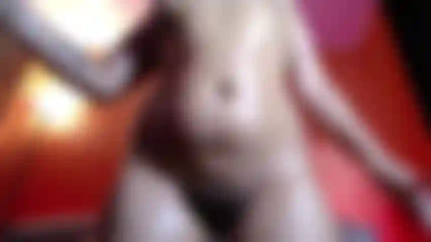 Naked and glowing—covered in oil, every move is pure temptation.